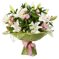 Eye-catching boxed floral arrangement typically including lilliums, iris, gerberas and roses